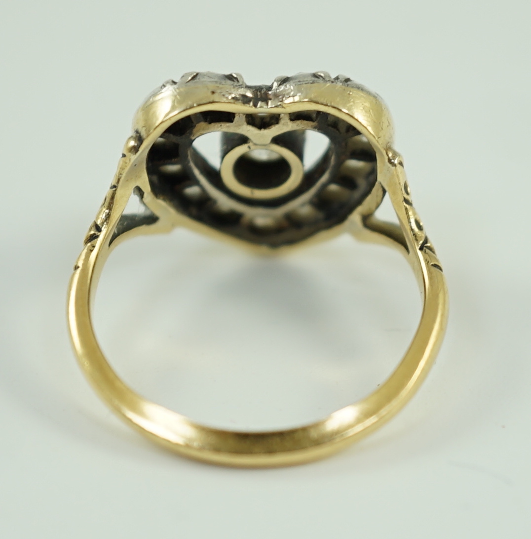 An antique gold and diamond set heart shaped open work cluster ring